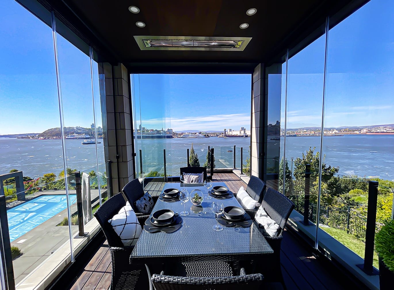 Balcony dining area enclosed with panoramic glass