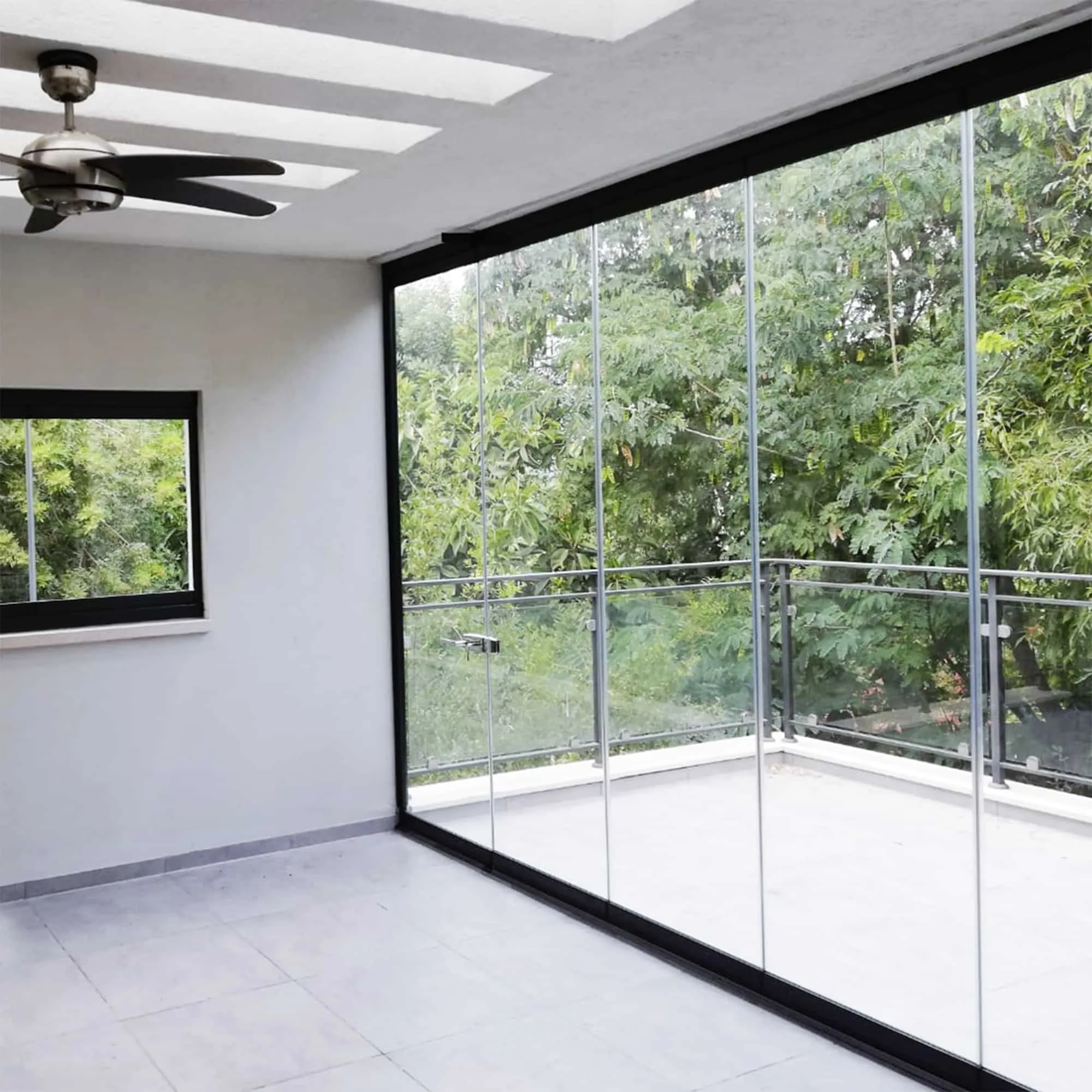 Indoor sunroom with full sliding glass doors