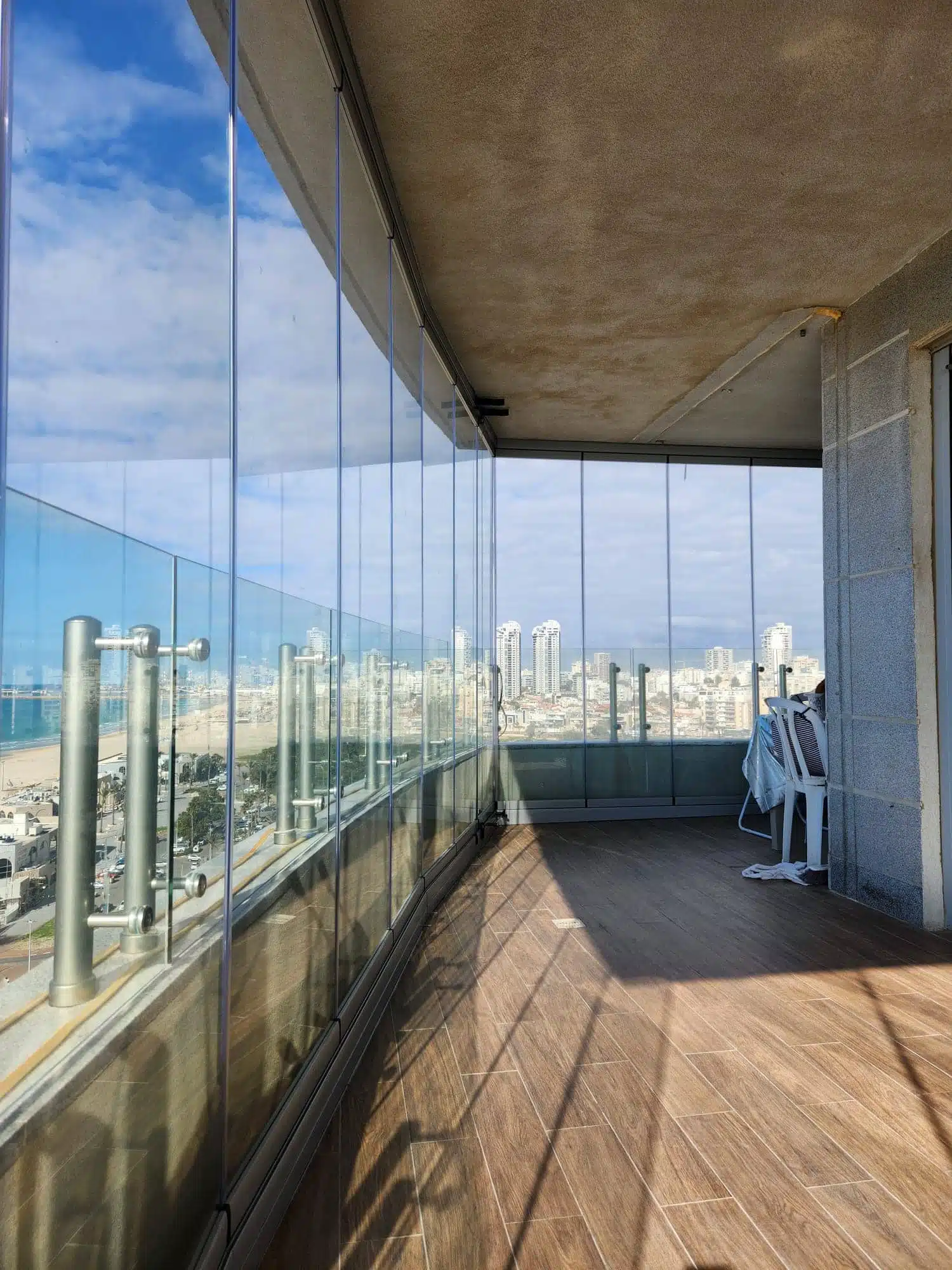 High-rise terrace featuring frameless glass enclosure