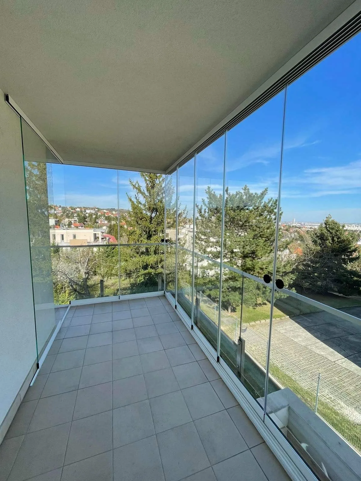 Apartment balcony with glass panels