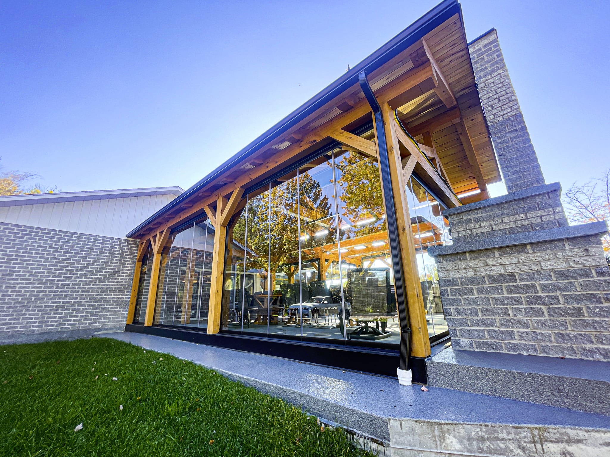 Terrace view through transparent sliding glass enclosure