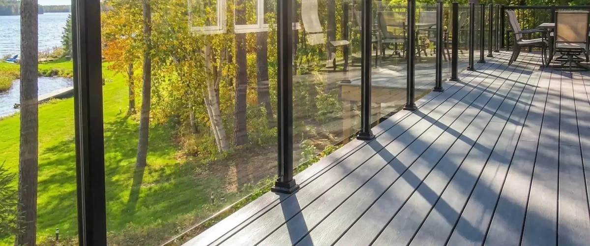 Enjoy unobstructed lake views with topless glass railings designed for cottage living.